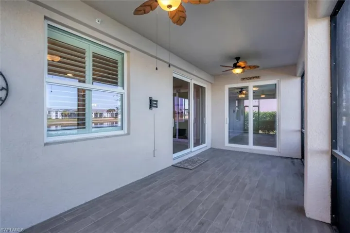 Unfurnished sunroom with a ceiling fan