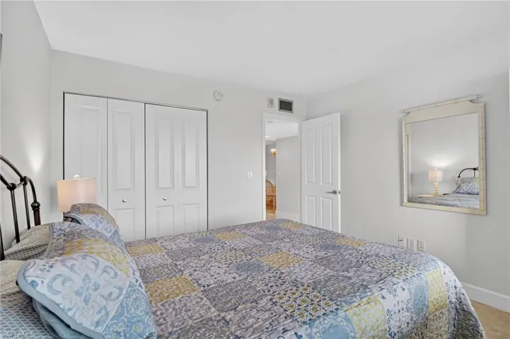 Bedroom with carpet and a closet