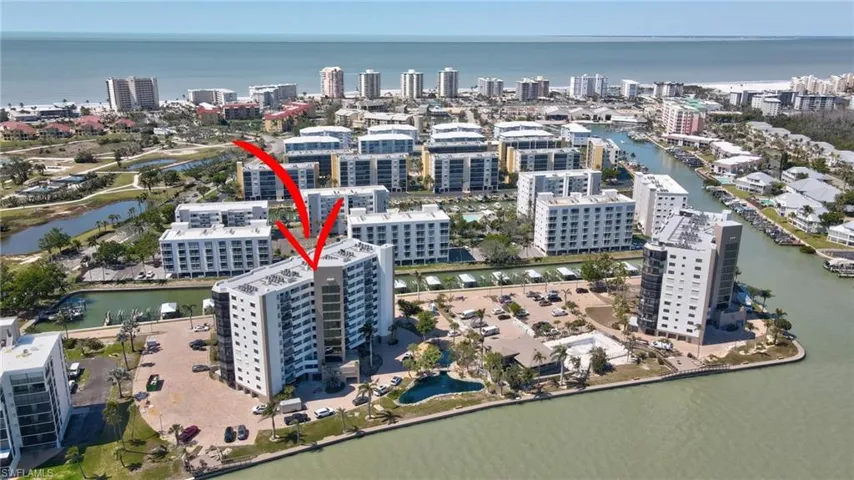 View of property location featuring a nearby body of water and nearby urban area