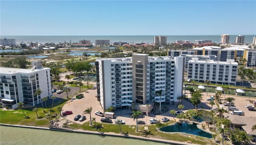 View of urban area with a large body of water and apartment complex