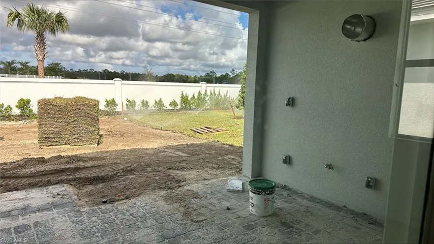 Covered lanai with pre-plumbing for future outdoor kitchen with gas line to rear, hooded vent, GFI outlets, and hot/cold waterline with drain