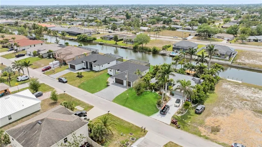 Drone / aerial view featuring a residential view and a water view