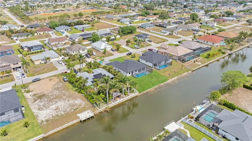 Aerial view with a water view and a residential view