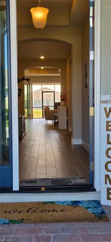 Entrance to property featuring stucco siding