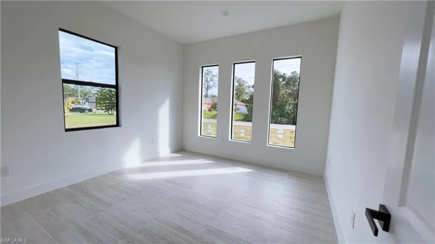 Spare room featuring a healthy amount of sunlight