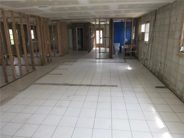 Misc room with light tile patterned floors