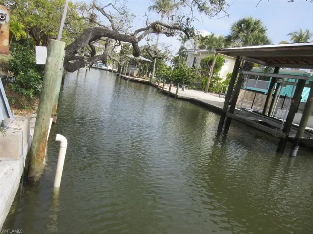 Dock area with a water view and boat lift