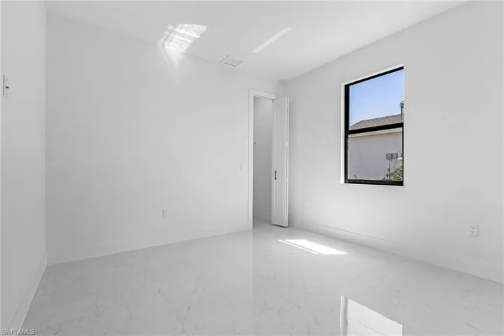Empty room with marble finish floor and baseboards
