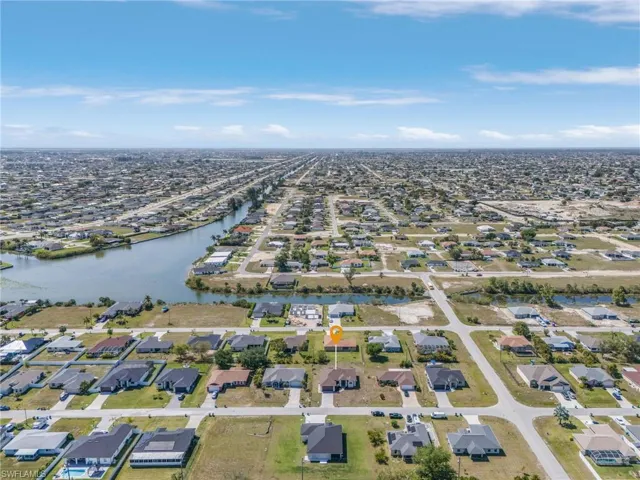Drone / aerial view featuring a water view and a residential view