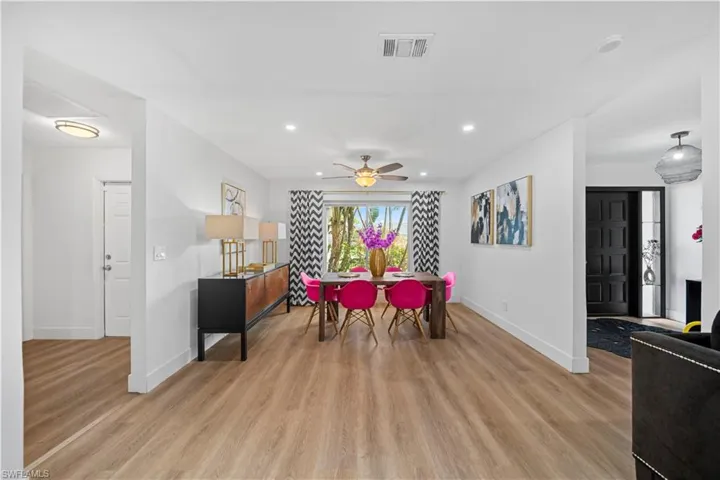 Bright interior with wood-finish flooring, recessed lighting, and a ceiling fan