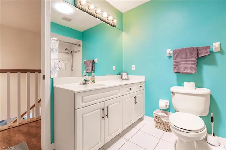 Bathroom with tile flooring, toilet, and vanity