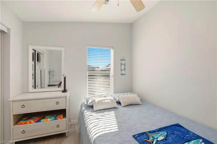 Bedroom with wood finished floors and ceiling fan