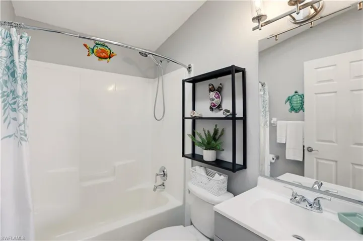 Full bath with vanity and shower / bath combo