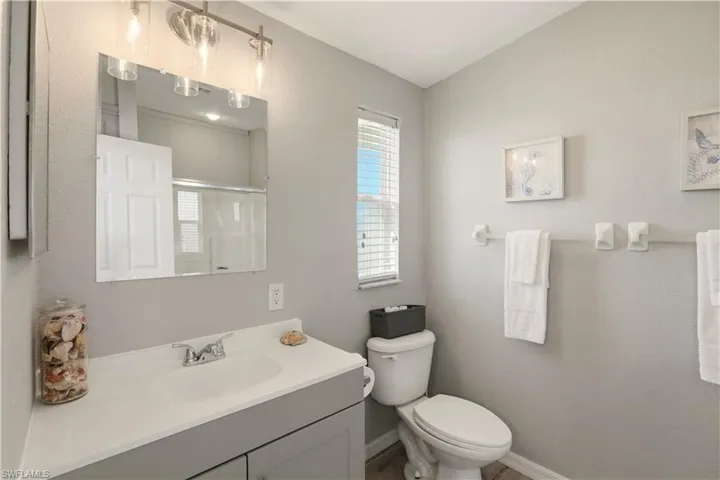 Bathroom with vanity and a shower stall