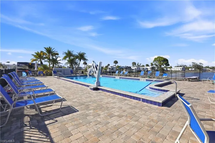 Community pool with a patio area
