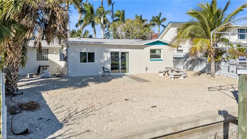 Back of property with stucco siding