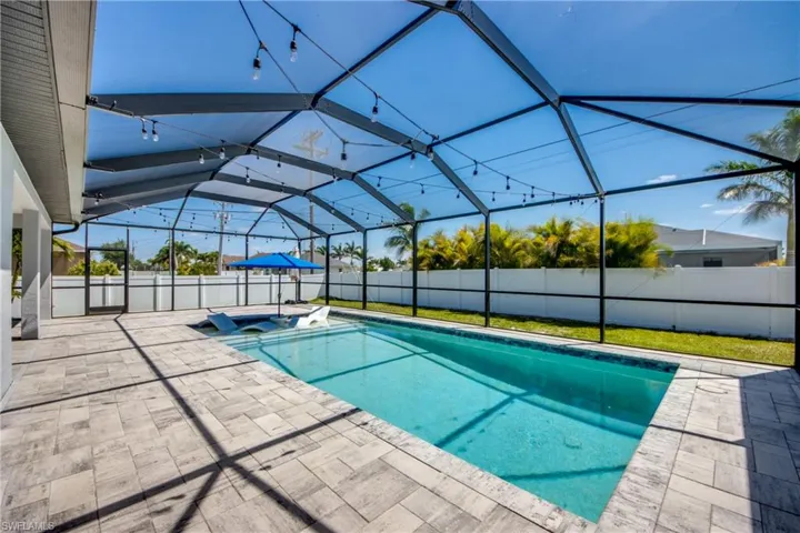View of pool featuring a fenced backyard, a patio area, a jacuzzi, and a fenced in pool