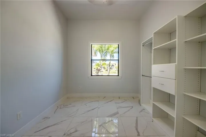 Spacious closet with marble finish floor