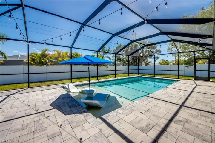 View of pool featuring a fenced in pool, a lanai, a patio area, and a fenced backyard