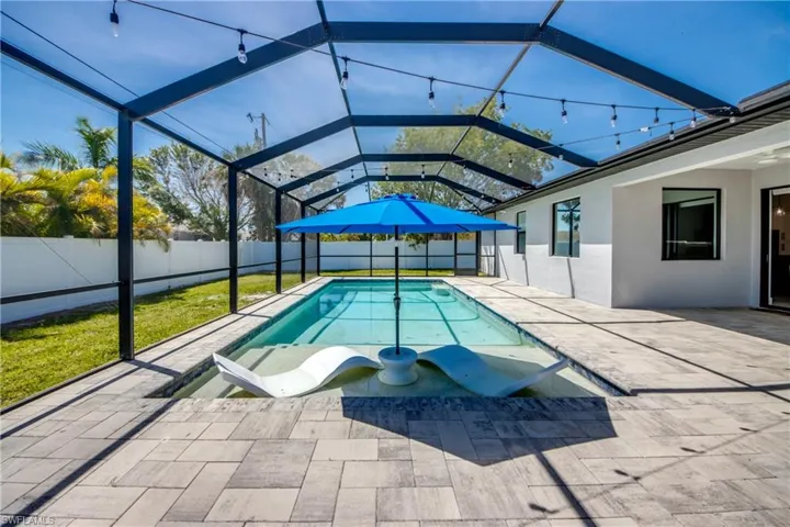 View of swimming pool with a patio, a lanai, a fenced backyard, and a fenced in pool
