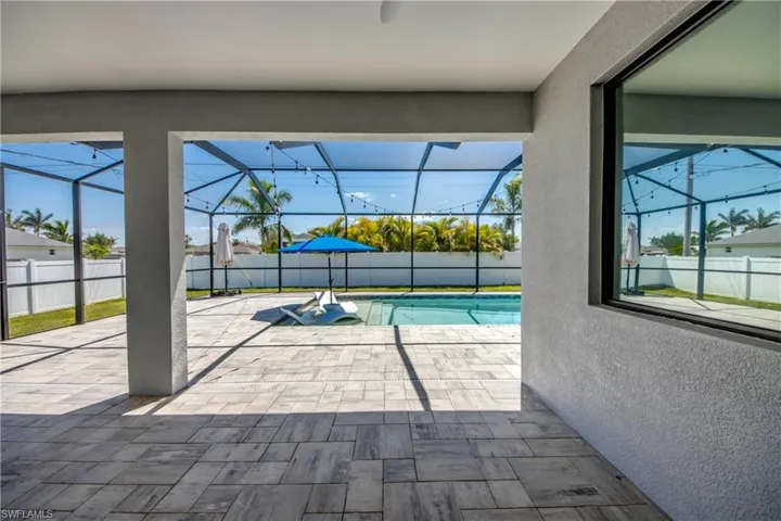 View of swimming pool with a fenced in pool, a lanai, a patio, and a fenced backyard