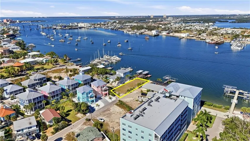 Drone / aerial view of numerous boat docks and a large body of water - Virtually Edited Image