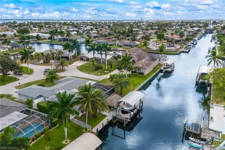 Expansive waterfront vista showcasing the deep-water canal and boat dock.
