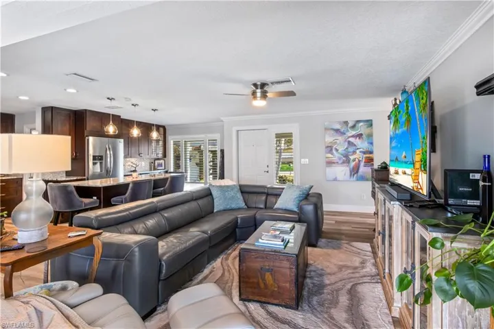 Spacious living area with a welcoming view of the front door and entryway.