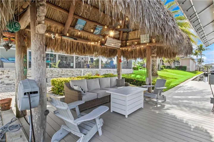 Boater’s dream with direct access and a peaceful tiki hut by the water.