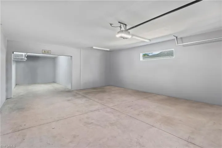 Spacious garage with room to store extra toys, golf cart, or additional storage.