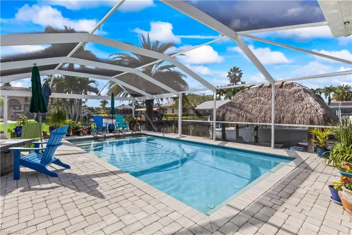Tranquil water views complete this exceptional outdoor space.