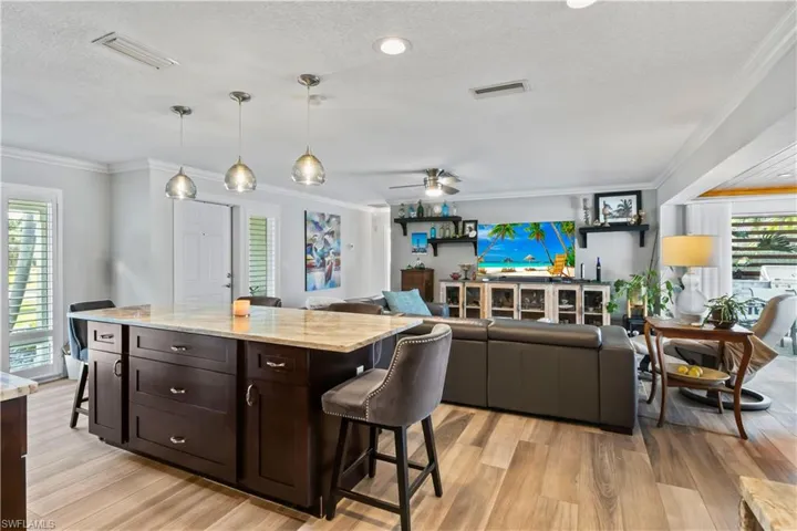 Open kitchen connecting effortlessly to dining and living areas, perfect for gatherings.