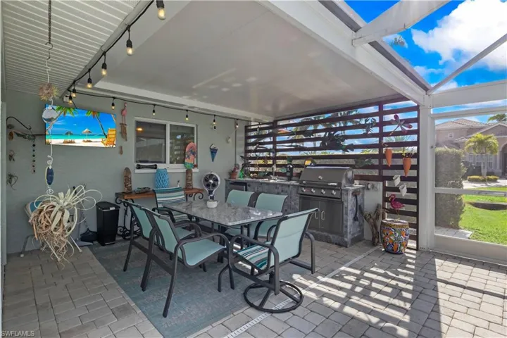 Fully equipped outdoor kitchen with built-in grill, perfect for entertaining.