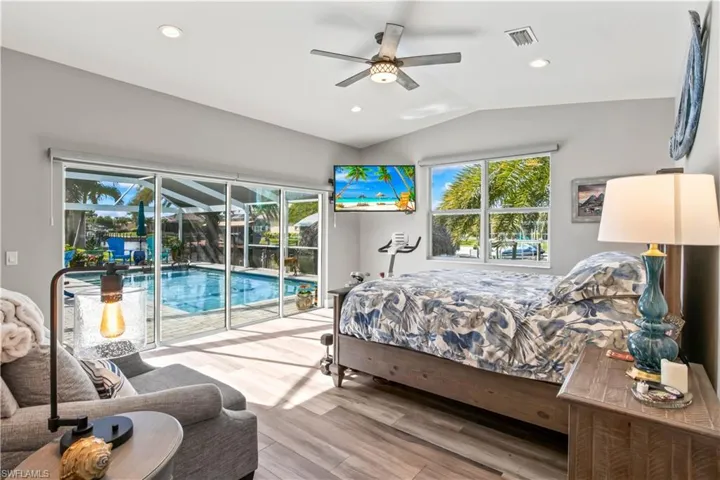 Tranquil master suite featuring a relaxing atmosphere and easy access to the pool and lanai.