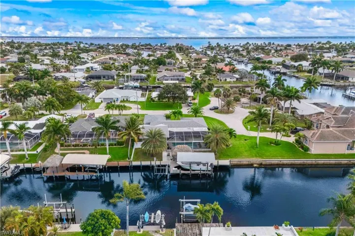 Aerial perspective of serene waterway views and the private dock area.