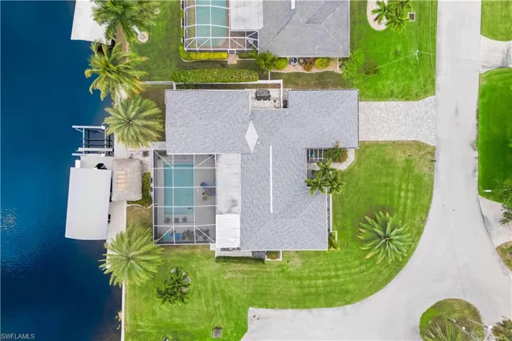 Aerial view highlighting the home’s roof and overall layout on the oversized lot.