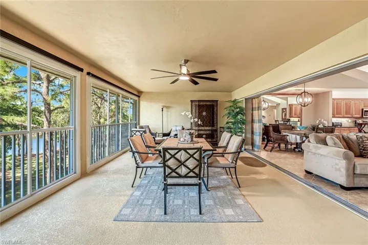 Sunroom / solarium with a chandelier