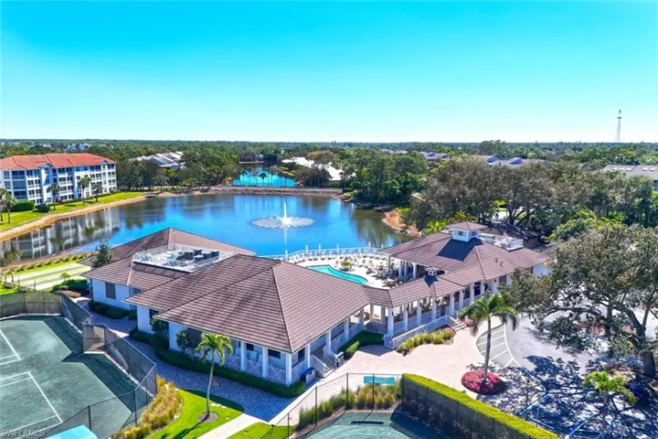 Aerial view of a nearby body of water and apartment complex / building