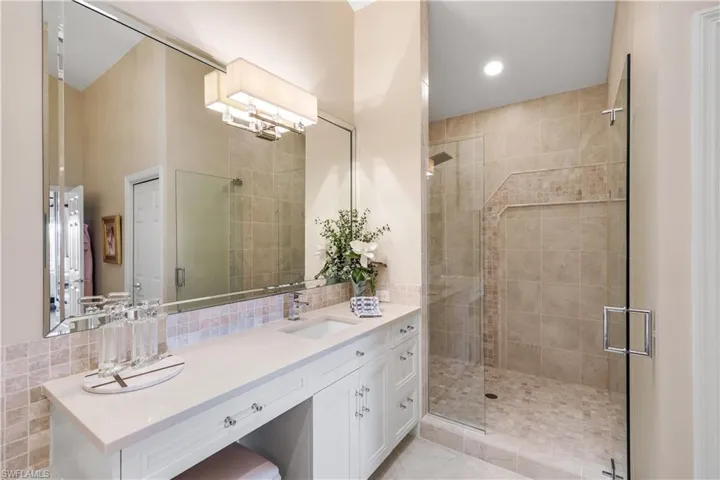 A beautifully finished ensuite bathroom with a walk-in shower and generous vanity space.