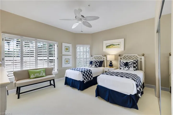 A cheerful guest room with plenty of space for visiting family and friends.
