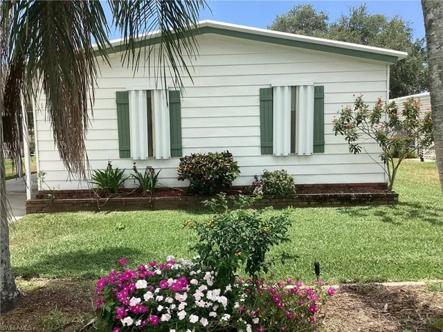 View of home's exterior with a lawn