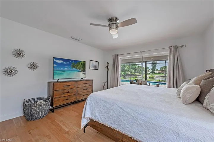 The primary bedroom features access to the lanai