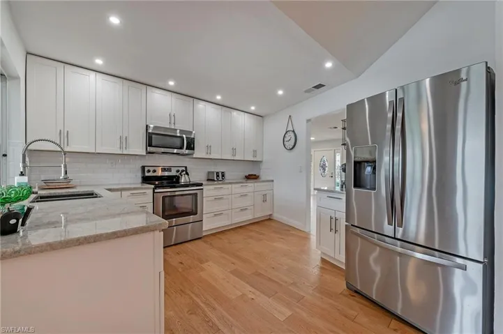 Kitchen with perspective to entryway