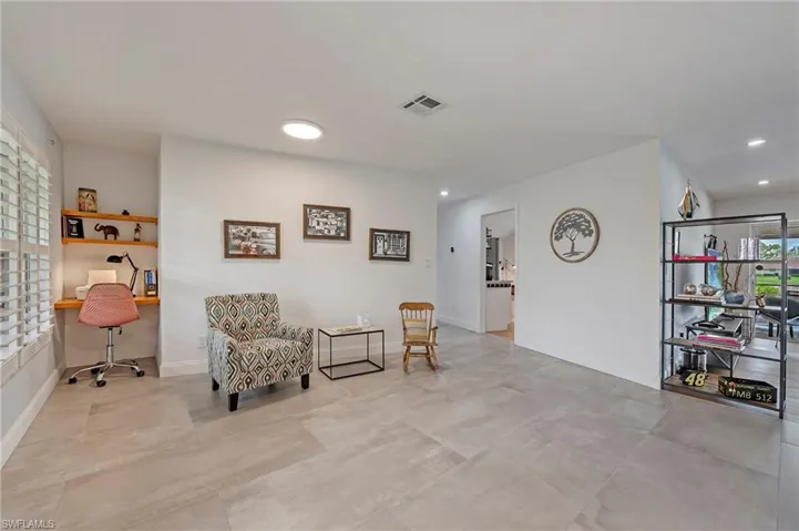 Entry way leading into work nook and sitting area