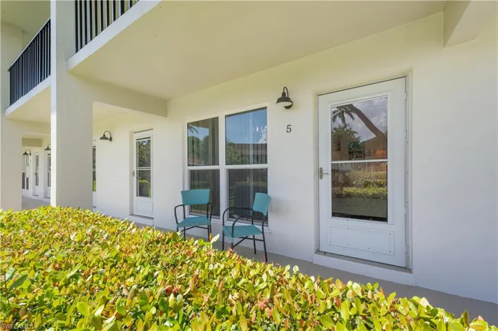 Entrance to property featuring stucco siding and a patio area