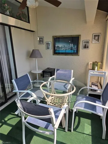 Balcony featuring ceiling fan and outdoor dining area