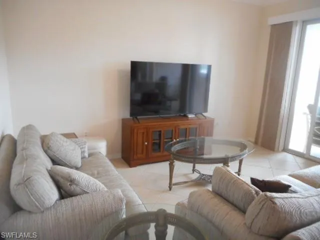 Living area with light tile patterned floors