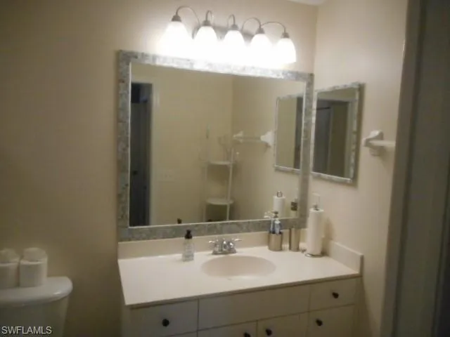 Bathroom featuring vanity and toilet
