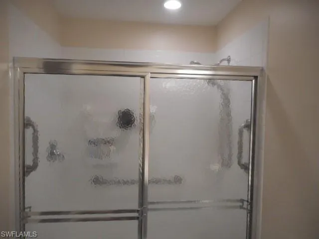 Bathroom featuring a shower stall