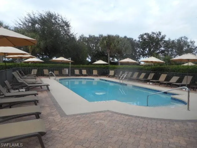 Community pool featuring a patio area